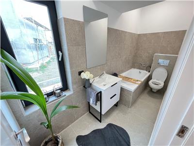 Casa parter, doua dormitoare , living cu bucatarie, baie, terasa, acces piscina